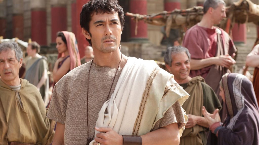 #1 Hiroshi Abe (center), Age 57, played the leading role in a comedy called Thermae Romae in which a Roman architect supposedly time traveled to modern day Japan for inspiration to build bath houses in Rome, Image Sourced from Binged