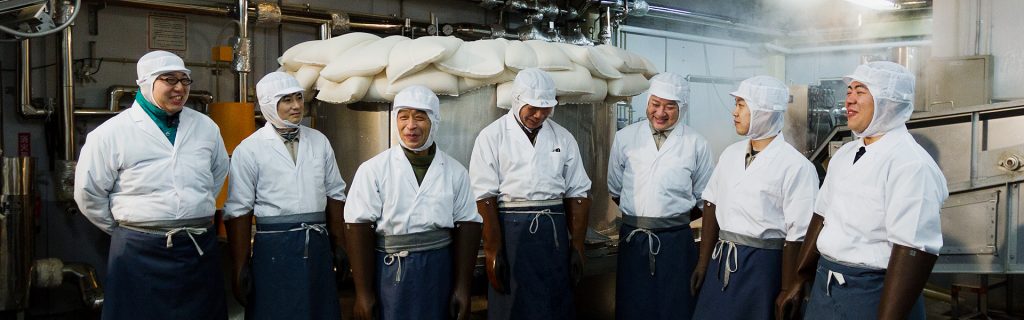 Plant workers at the Ishimoto Sake Brewery