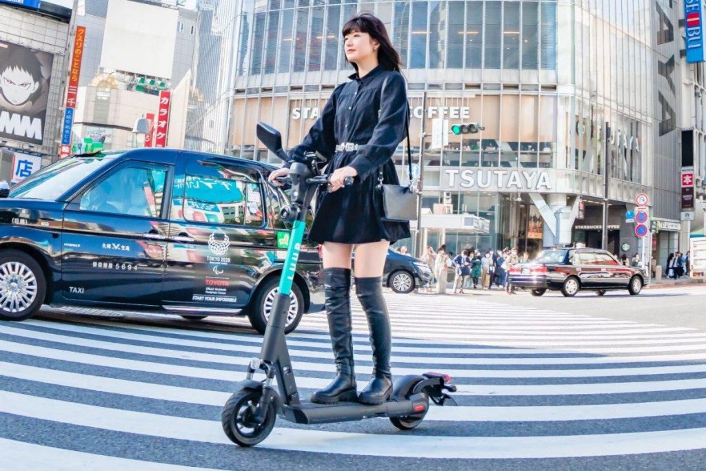 Riding an e-scooter in Shibuya
