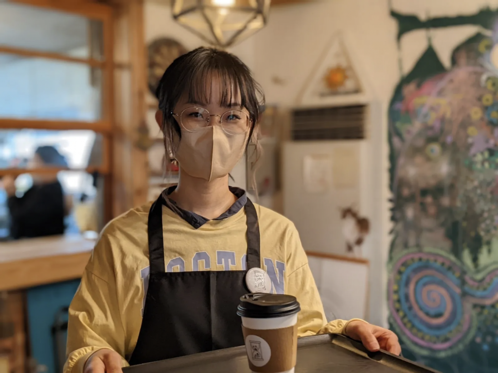 female employee at the stuttering awareness cafe