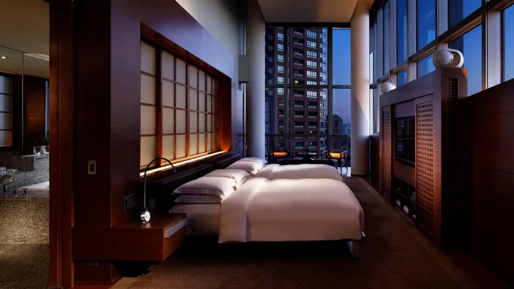 luxury master bedroom with two beds in luxury hotel room in Tokyo