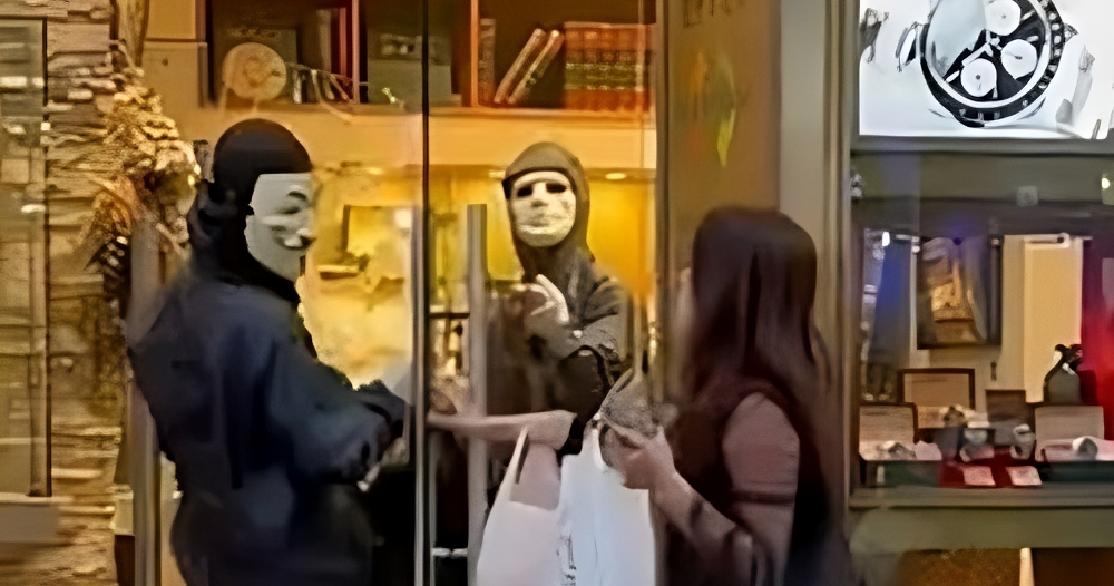 One robber dons a Guy Fawkes mask during the Japan Heist that occurred on May 8th.